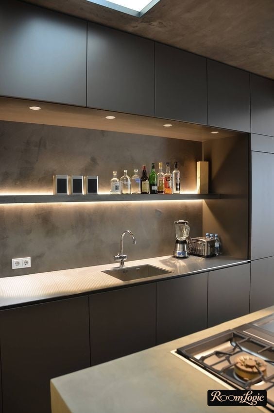 modern small loft-style kitchen with floor-to-ceiling cabinets