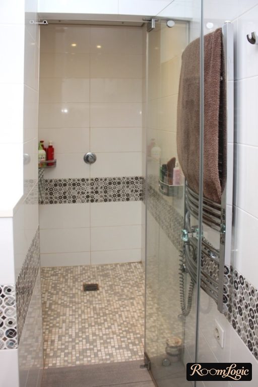 mosaic floor sloping to the shower threshold