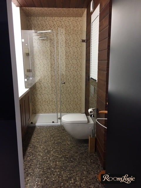 mosaic on the walls and floor in the shower