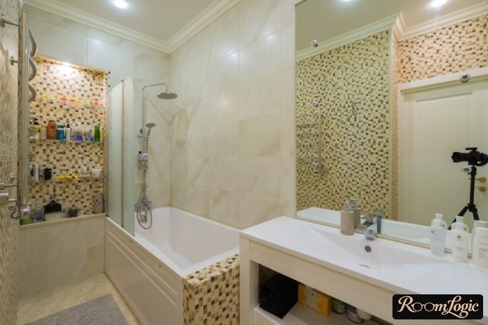 mosaic on walls in small bathroom
