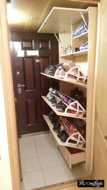 narrow wall boot cabinet extending to the ceiling in the entryway