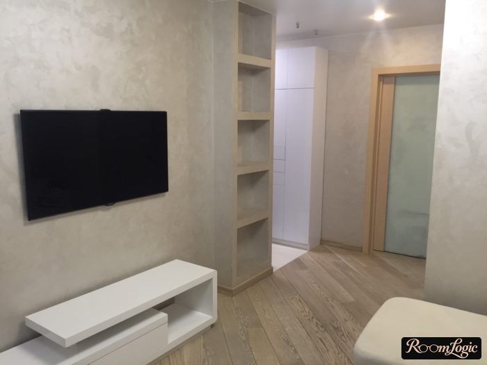 narrow white matte closet without handles in modern corridor interior
