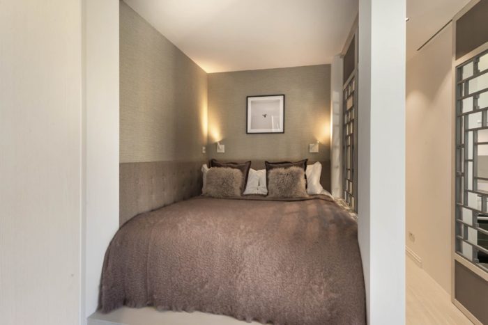 niche with partition for bed in studio