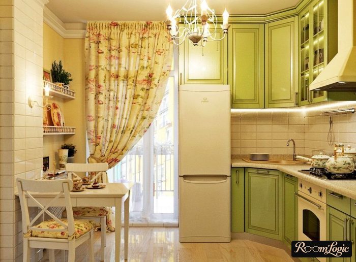 olive colored Provence style kitchen with balcony and curtains