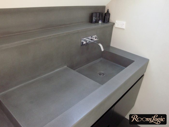 cast sink with stone countertop