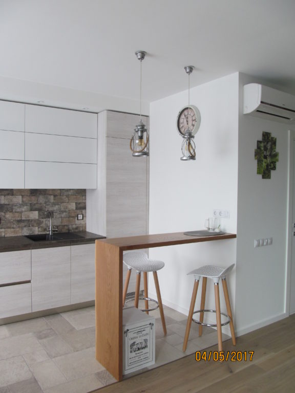 open breakfast bar in kitchen-living room