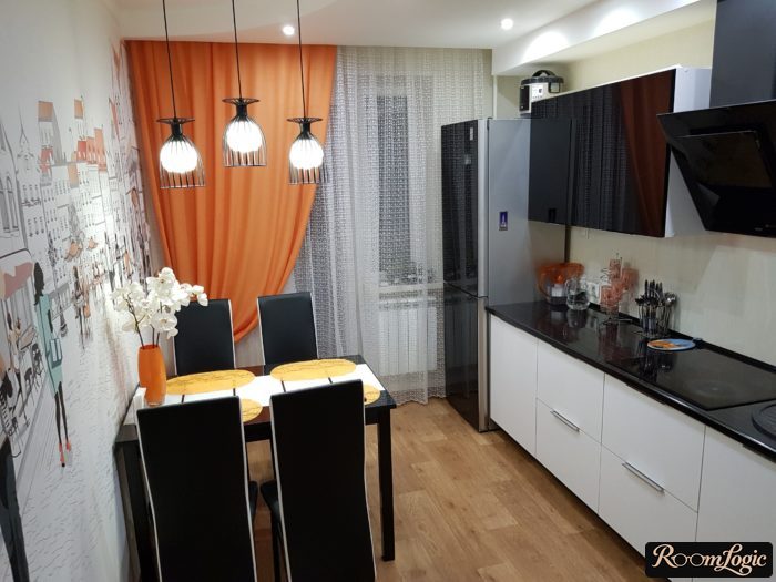 orange curtains on one side in the kitchen with a balcony door