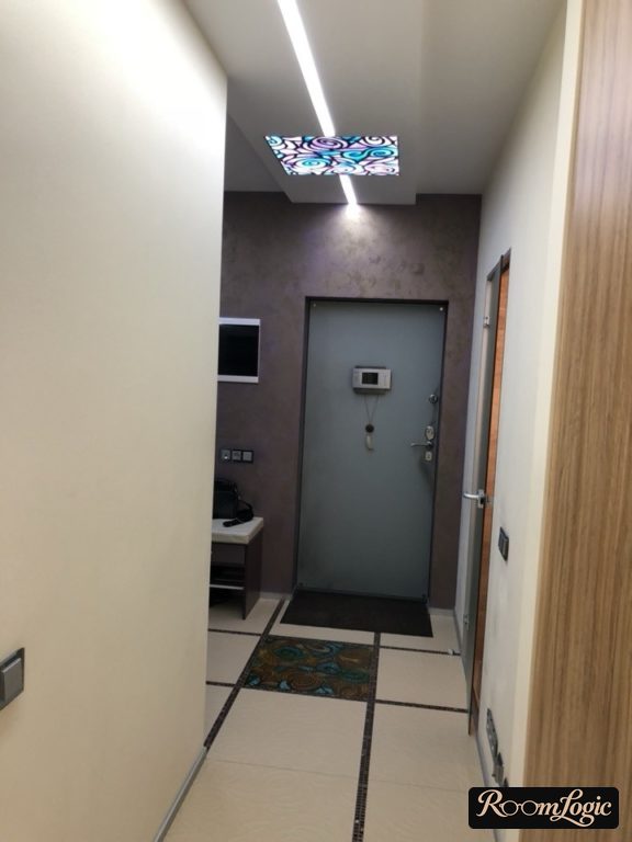 Overcrowded not-so-modern design of a small entryway