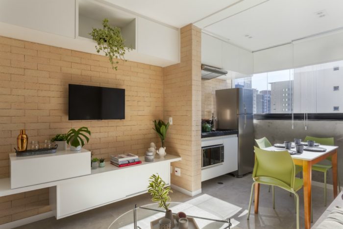 Overhead storage cabinets in a studio apartment