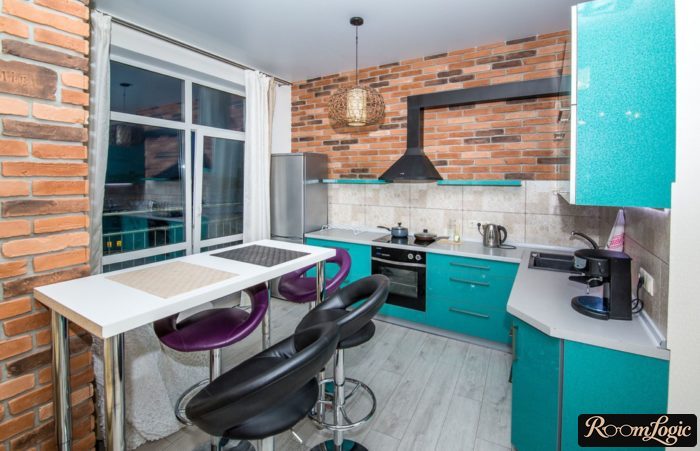 range hood with a box in a loft-style kitchen without upper cabinets on one side