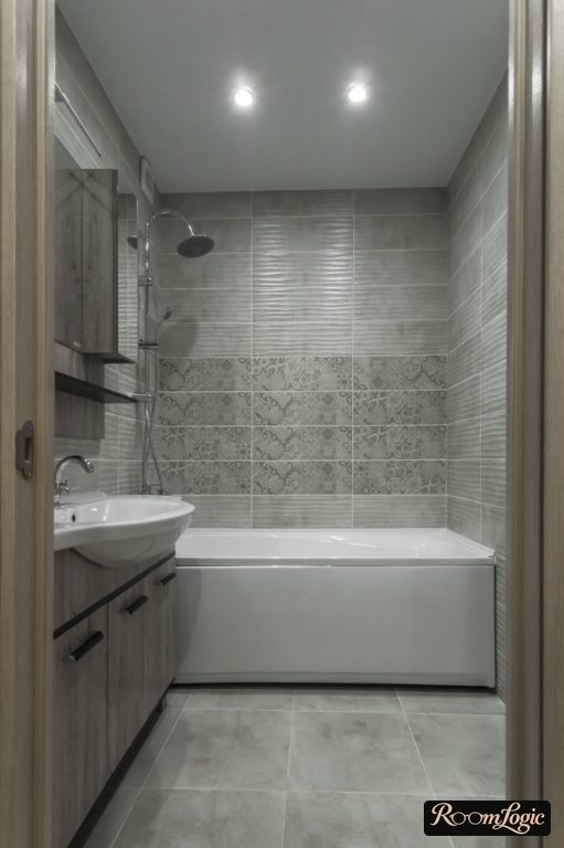 rectangular gray tile in the bathroom of a tiny apartment