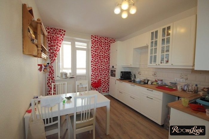 red polka dot curtains on a white kitchen
