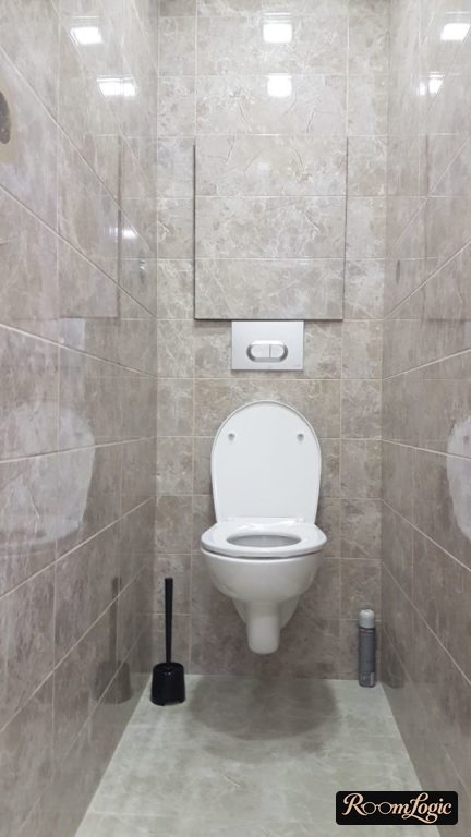 remodel of a small toilet with a hidden access panel