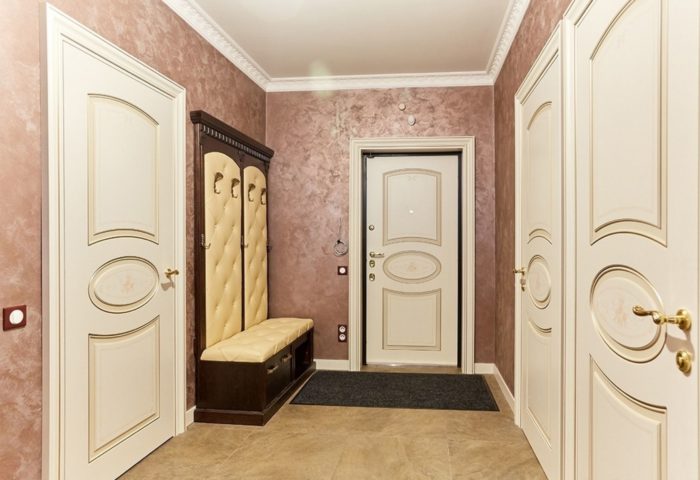 sand-colored tile in a classical entryway