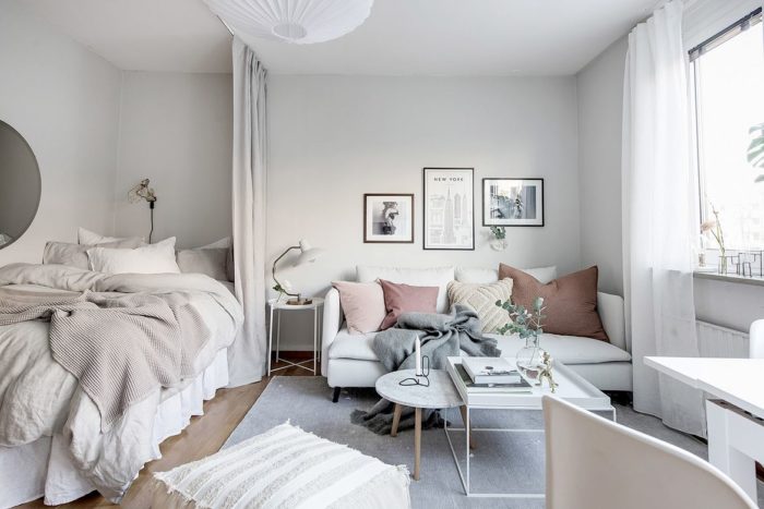 scandinavian style studio with a bed