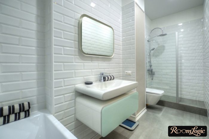 Scandinavian-style white bathroom with a shower