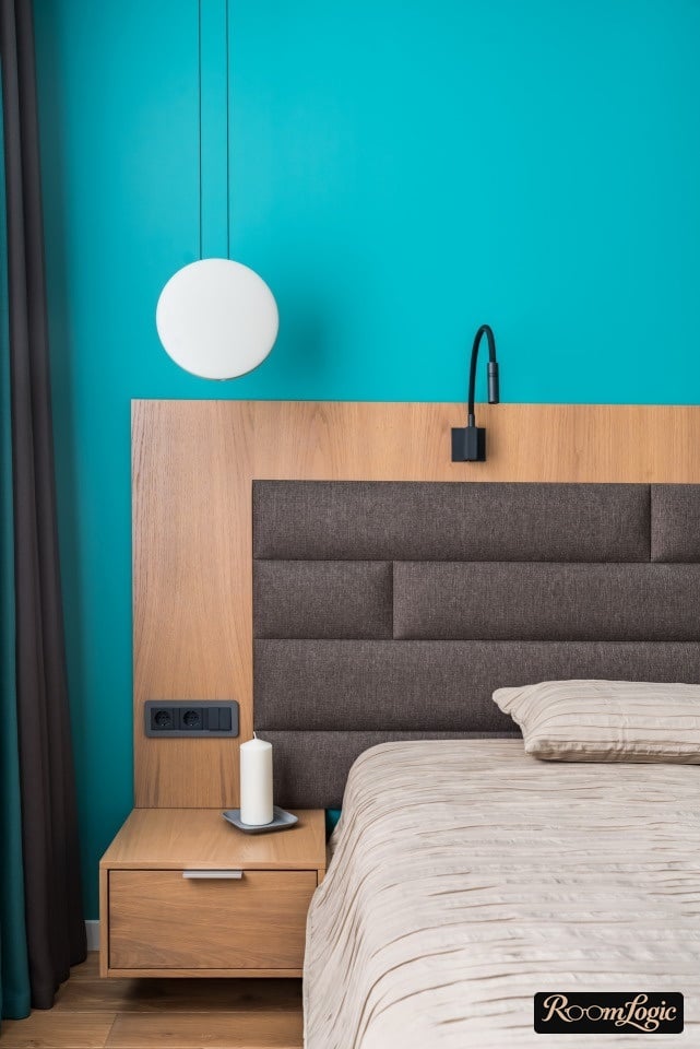 scandinavian styled bedroom with light blue wall