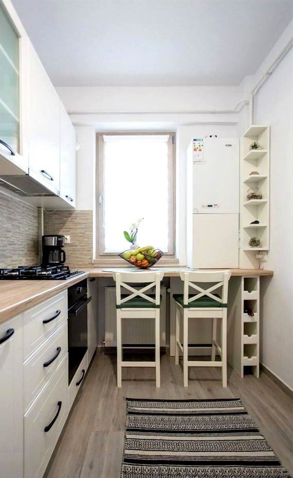 scandinavian kitchen with bar counter by the window