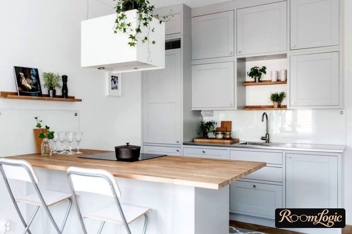 scandinavian styled kitchen with breakfast bar and wooden countertop