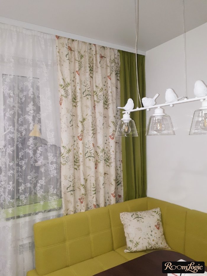 shades and sheer curtains in the kitchen with a balcony
