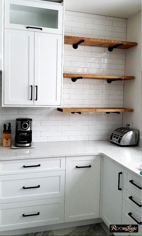shelves next to upper cabinets in the kitchen