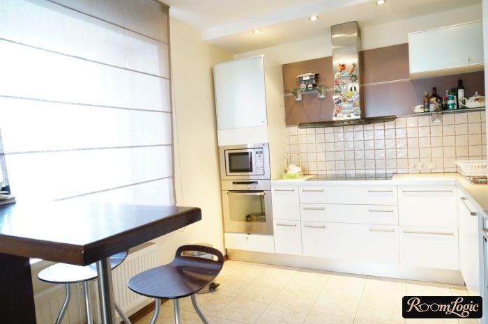 short breakfast bar against the wall in the kitchen