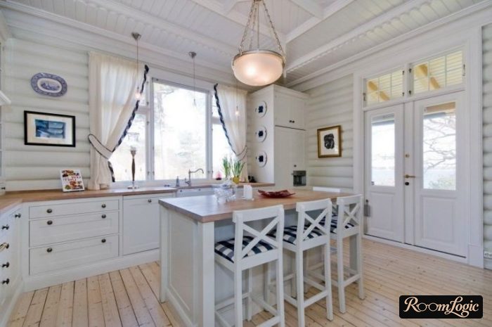 short hanging curtains in a Provence-style kitchen in a countryside house