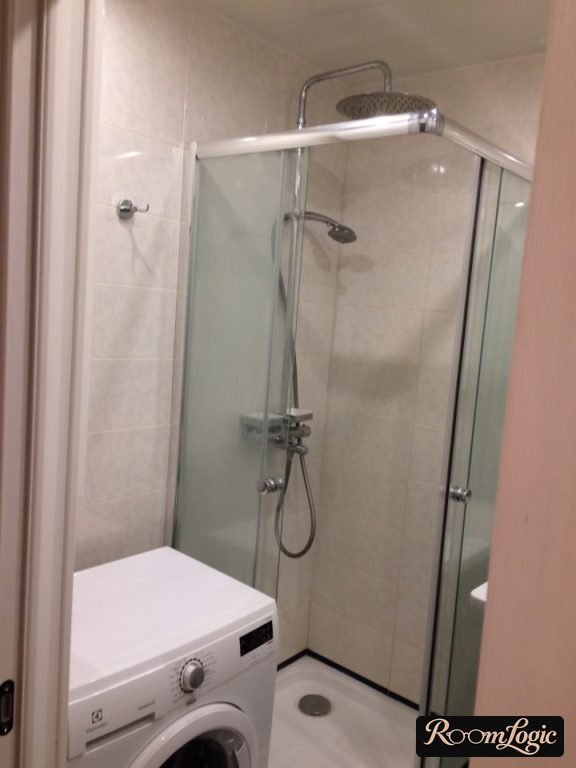 shower and washer in bathroom