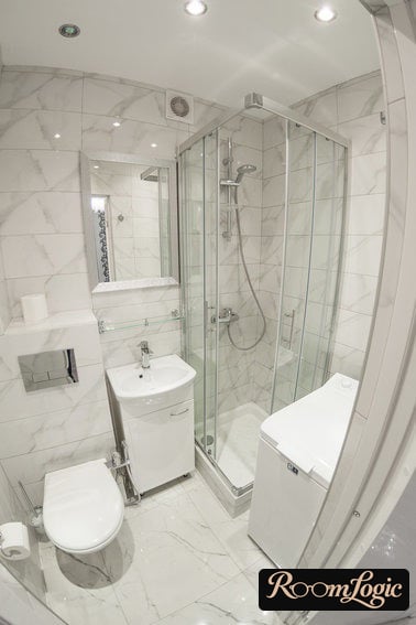 shower corner in a tiny apartment with toilet