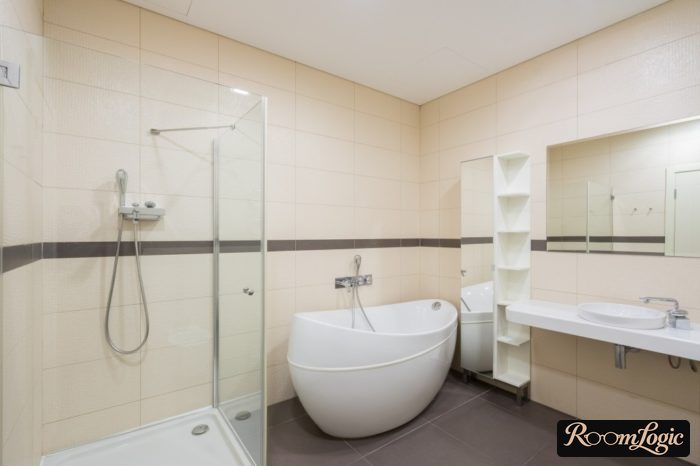 shower with a shower pan and glass walls