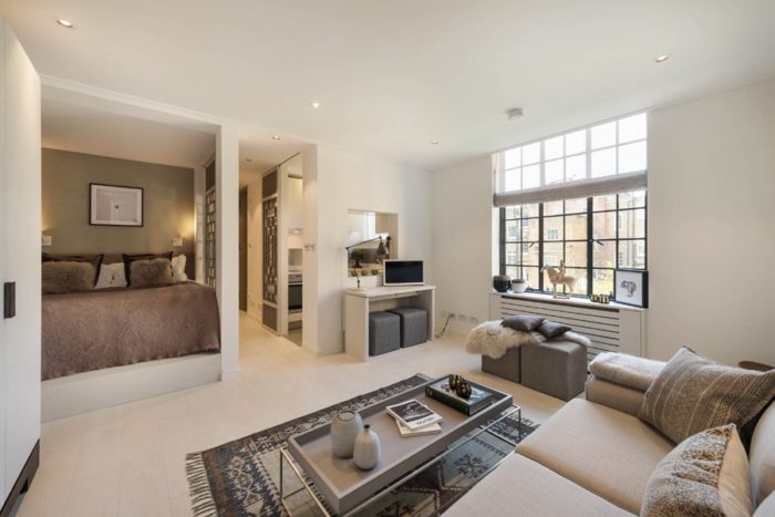 simple studio interior with a bed