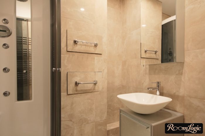 sink basin in a small bathroom with a shower