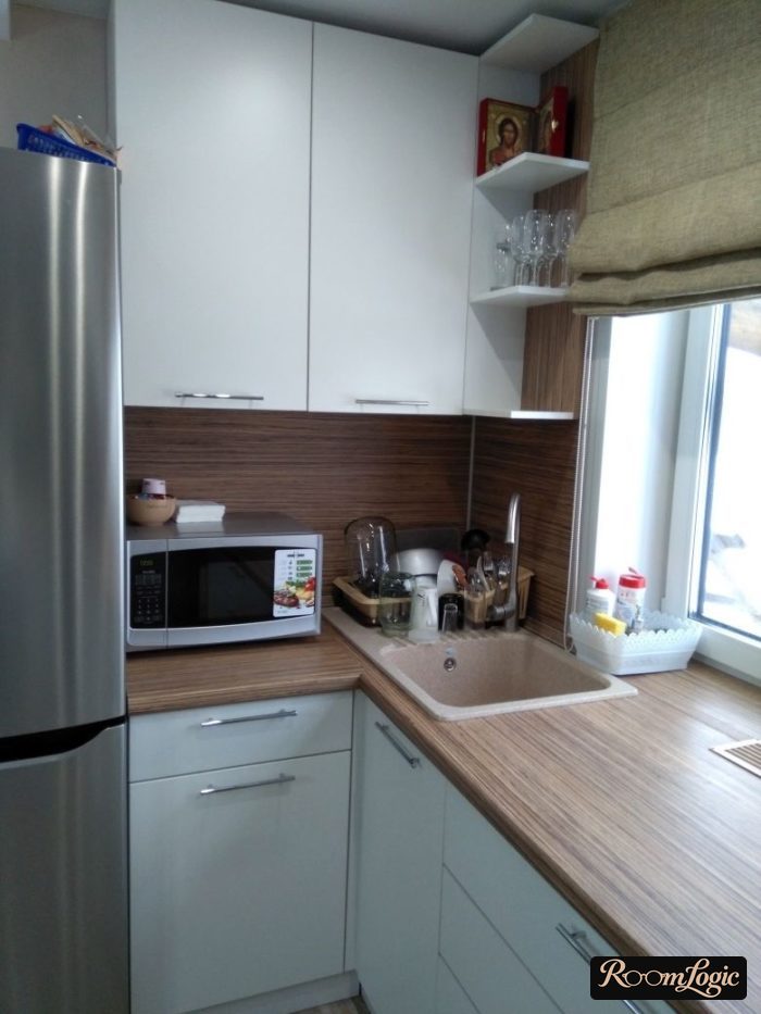 sink by the window in a U-shaped kitchen