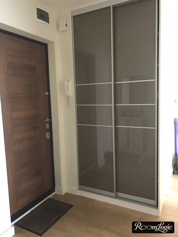 sliding-door wardrobe from floor to ceiling in small entryway