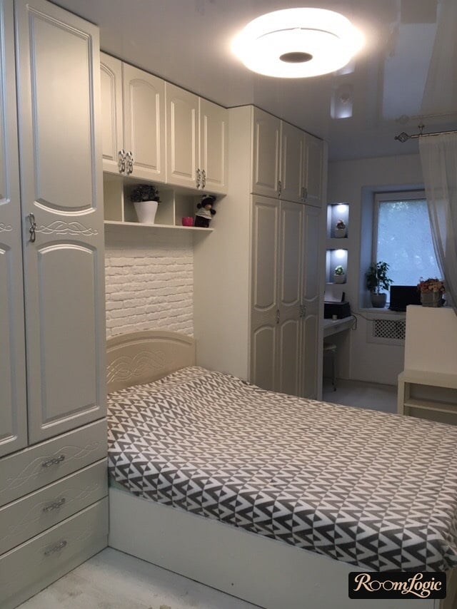 small bedroom with a large bed and closet