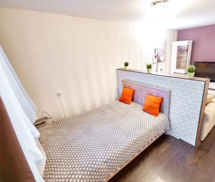 Small double bed in a one-bedroom apartment