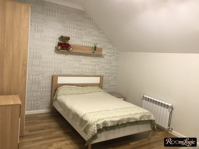 Small double bed in a teenager's attic room
