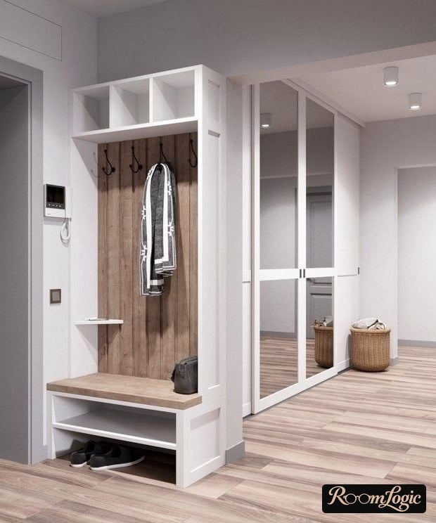 small entryway with a bench for sitting and shoe storage