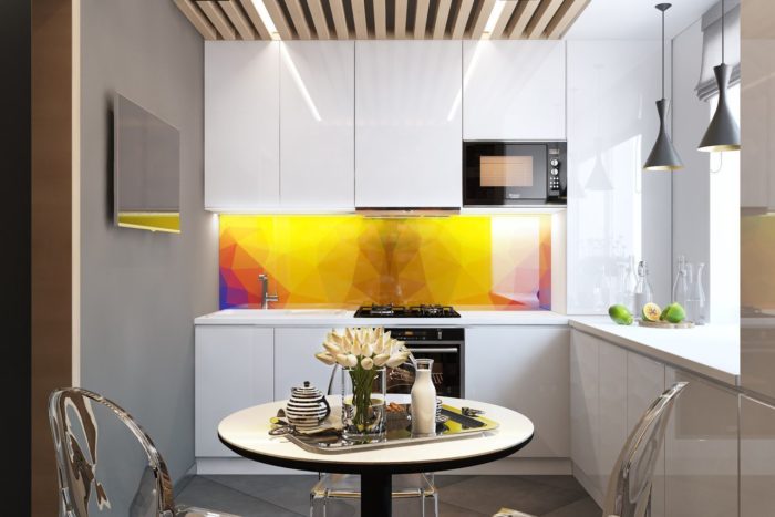small kitchen with bright yellow backsplash