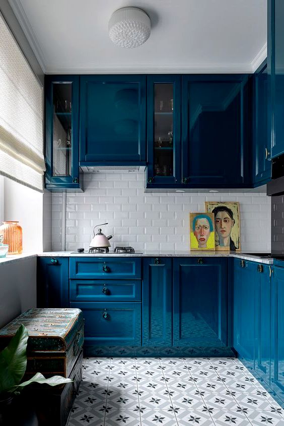 small kitchen with glossy blue cabinet fronts with routed detailing