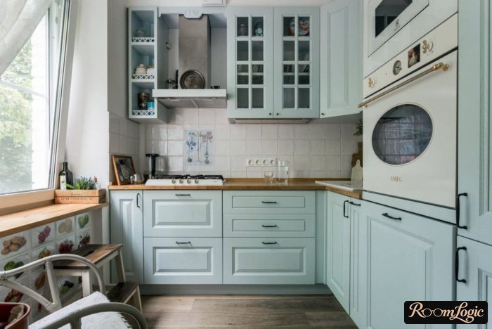 small light blue kitchen in neoclassical style