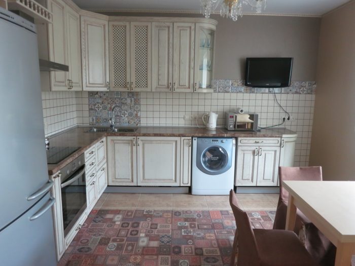 small square tile on the backsplash in a classic kitchen