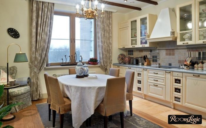 straight curtains and beams on the ceiling in a Provence-style kitchen interior