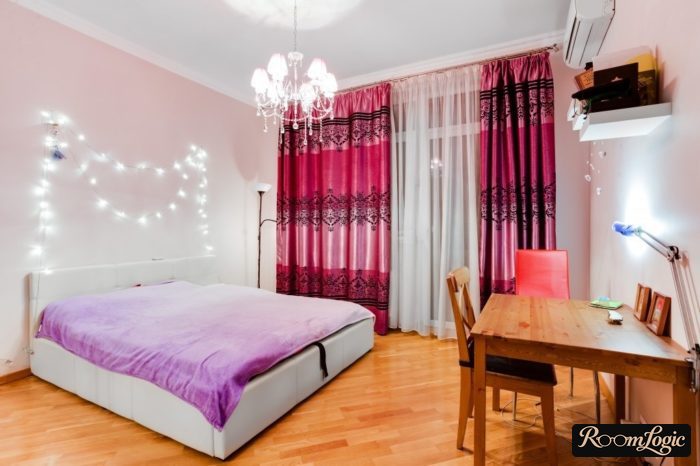 String lights on the wall in the bedroom