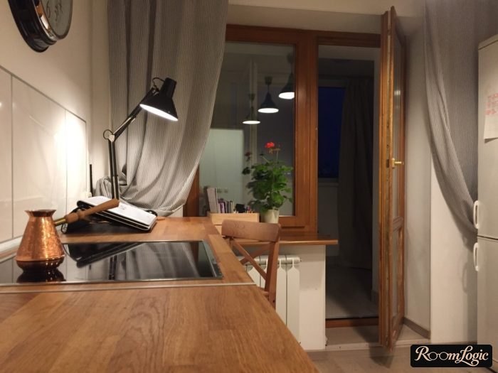 striped gray curtains on the kitchen with a balcony