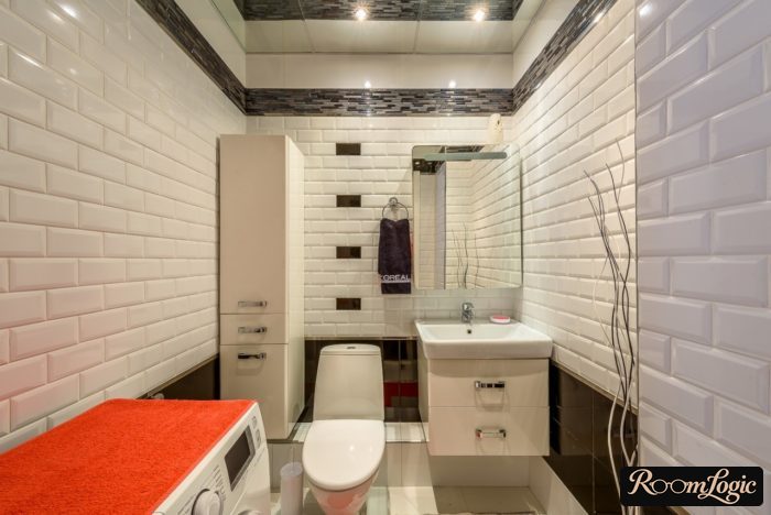 stylish interior of a small bathroom with a washer