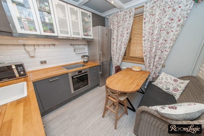 symmetrical curtains on the kitchen combining with pillows