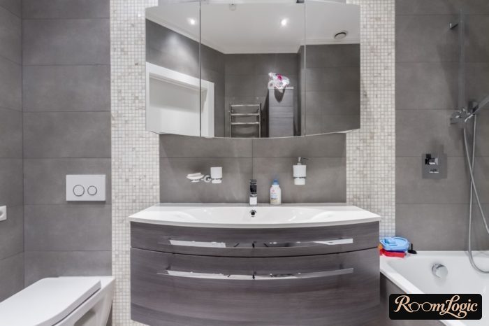 Symmetrical zoning in the bathroom with tile