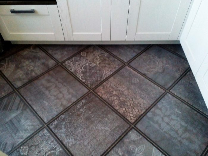 textured tile on the kitchen floor