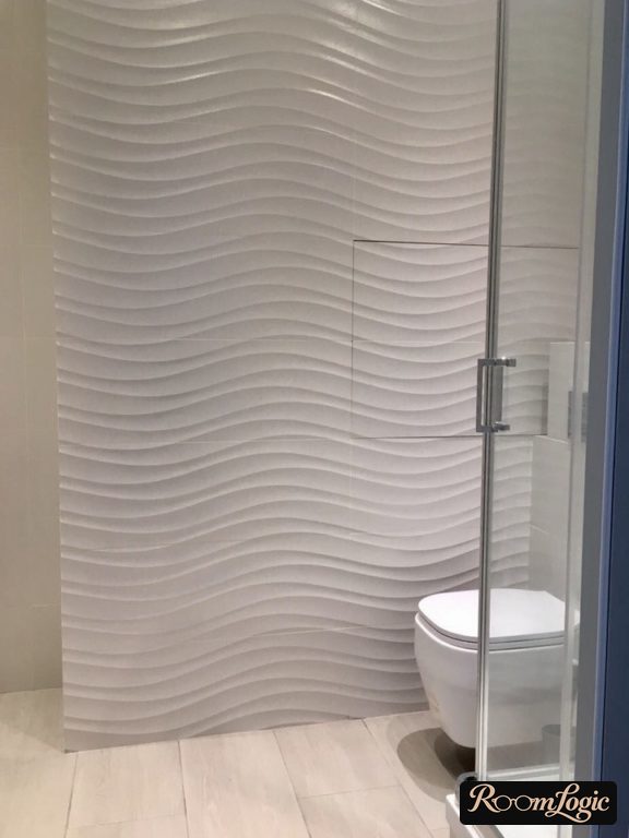 textured wave tile on toilet wall